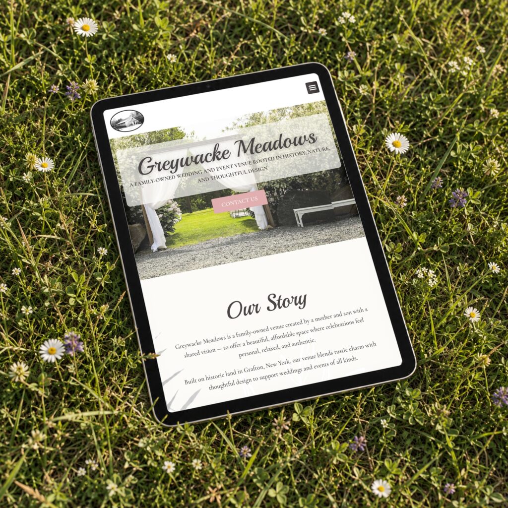 Tablet mockup of the Greywacke Meadows event venue website homepage in a garden setting, designed by Posted Social