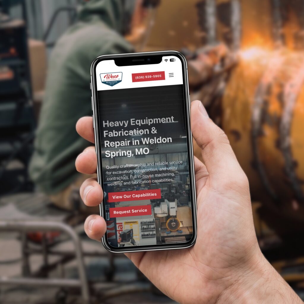 Phone mockup of the Wesco heavy equipment fabrication website homepage at a welding shop, designed by Posted Social